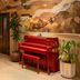 The Flat Iron Hotel, Asheville lobby with a red piano and mural wall art