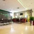 Hotel Glodok Plaza lobby bar in Jakarta with seating, counter and tiled floor