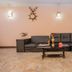 OYO 11457 Kathmandu Resort Hotel lobby with black sectional sofa and carved brick fireplace in Kathmandu