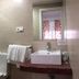 Hostal Mellizo in Lebrija bathroom with shower, sink, toilet and towel rack