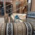 AG Hotel in Abu Dhabi lobby seating with patterned upholstered benches beside a polished staircase and glass railing