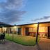 Cootamundra Gardens Motel in Cootamundra courtyard with covered outdoor seating and guest rooms
