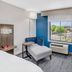 Holiday Inn Express & Suites Colorado Springs-First & Main By IHG room with chaise lounge and window view
