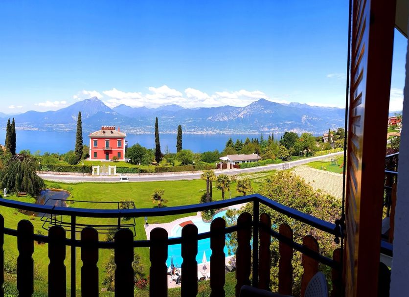 Hotel Diana in San Zeno di Montagna balcony view of lake, mountains, garden and pool