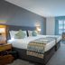 Westgrove Hotel, Kildare guest room with king bed, desk, and small sitting area by the window