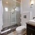 Ascot Boutique Hotel Johannesburg bathroom with glass shower, toilet and vanity sink