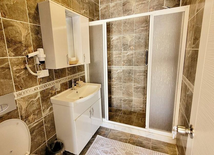 Arp Dalyan bathroom with shower, sink, and toilet in Dalyan, Mugla
