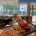 Ocean Beach Hotel in Miami Beach breakfast counter with fruit, pastries and seating by large windows