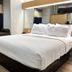 Microtel Inn & Suites by Wyndham Albertville guest room with queen bed and window seat