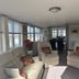 Hogwarts Bed and Continental Breakfast in Sheerness, bright lounge with cream armchairs and large windows