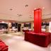 Villa Fiorita in Monastier di Treviso lobby display area with red-draped tables and bright ceiling lights