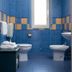 Oasi Azzurra bathroom in Villafranca Tirrena with blue tile, toilet, bidet and window