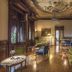 Hotel Laurin in Salò elegant lounge with frescoed ceiling, antique furnishings, and large windows