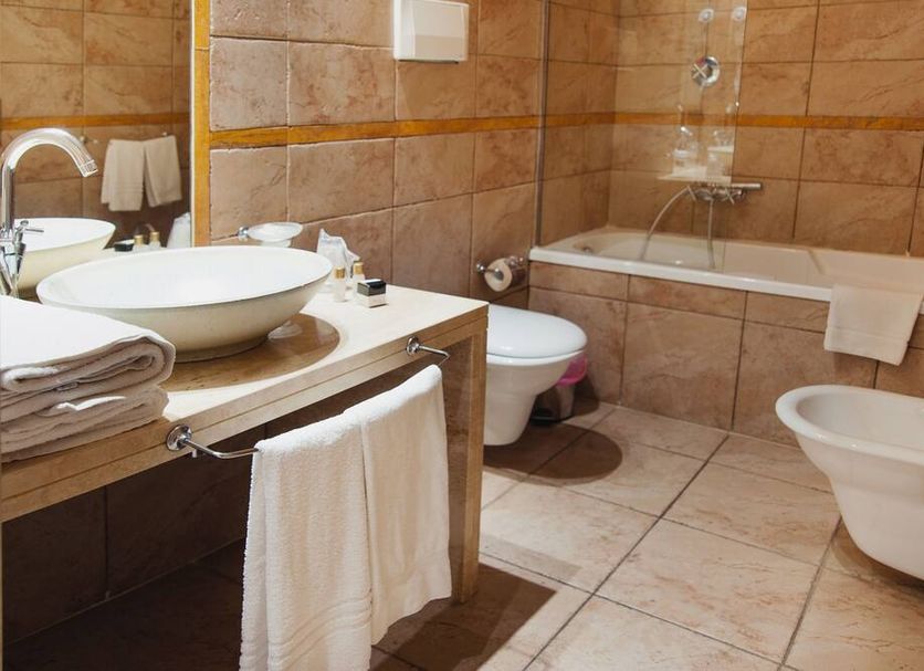Villa Zina Family Resort bathroom in Custonaci with bathtub, bidet, toilet and vessel sink