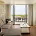 Halcyon - A Hotel in Cherry Creek, Denver suite with sofa, TV and balcony view