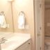 Treasure Island Resort by Royal American Beach Getaways bathroom with vanity, toilet and shower/tub combo