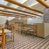 Best Western Gold Canyon Inn & Suites lobby with rustic wood beams, stone columns and seating area