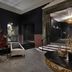 The Warrior Hotel, Autograph Collection in Sioux City: stylish lobby seating, ornate wall art, and a decorative table