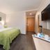 B&b Hotel Krefeld-Süd room with double bed, wall-mounted TV and modern simple decor in Krefeld