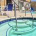 Triplodge of Santa Clarita pool with hot tub and desert hillside view in Forest Park