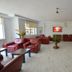 Kosk Sivas lobby lounge in Sivas with red sofas, coffee tables, and wall-mounted TV