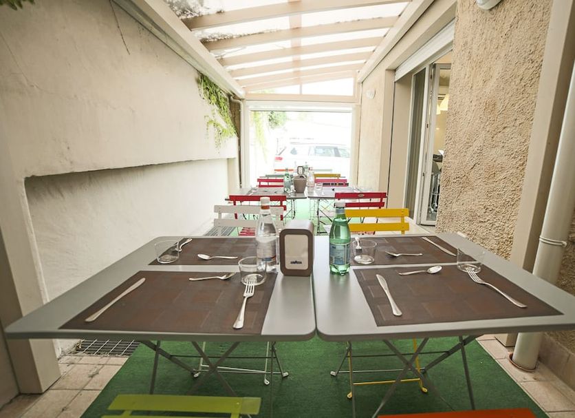 B&B Santa Maria Novella Florence outdoor covered dining terrace with tables set for breakfast