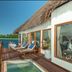 Konokono Beach Resort and Isaraya Over Water Villa in Michamvi with a private deck, loungers, and ocean views