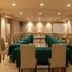 Orchardz Hotel Industri in Jakarta meeting room with U-shaped tables and projector screen