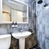 Hotel Atti Incheon bathroom with sink, toilet, mirror, and walk-in shower