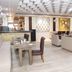 Hotel Taj Heritage in Agra restaurant lounge with modern seating, bar, and patterned ceiling
