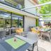 Appart'City Confort Tours terrace dining area with outdoor tables and chairs in Tours