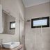 Agriturismo Terra dei Limoni bathroom in Noto with walk-in shower, sink, and wall mirror
