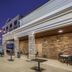 Best Western Plus Rose City Conference Center Inn in Thomasville with string lights over an outdoor patio