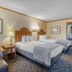 SureStay by Best Western Kansas City Country Inn North room with two beds and sitting chair