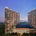 Hengshan Garden Hotel in Shanghai with twin high-rise towers and city skyline at dusk
