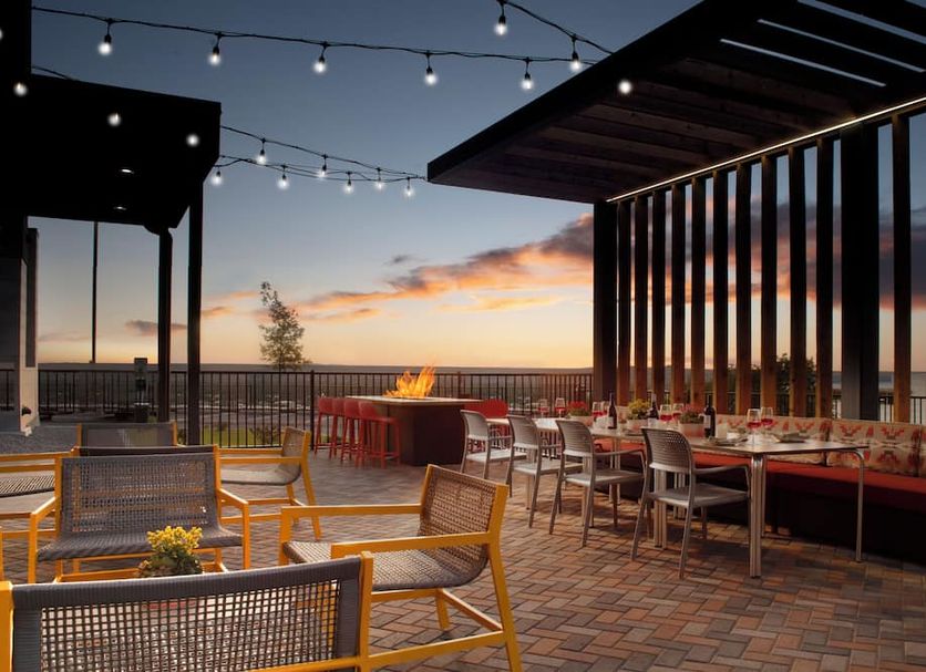 Rooftop patio at Home2 Suites by Hilton Albuquerque Airport with fire pit and sunset views in Albuquerque
