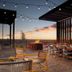 Rooftop patio at Home2 Suites by Hilton Albuquerque Airport with fire pit and sunset views in Albuquerque