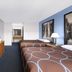 Super 8 by Wyndham Susanville guest room with two double beds, dresser and TV, plus window nook