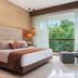 Jungala Hotel at VidantaWorld Riviera Maya room with large window, lush tropical view, and modern seating in Cancún