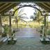 Ocean Beach Resort & Spa in Malindi: open-air pavilion with palm-lined oceanfront view