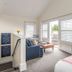 The Nantucket Hotel & Resort suite with sofa, ottoman, and balcony doors in Nantucket