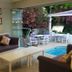Dalyan Terrace Hotel in Dalyan (Mugla) with a patio seating area beside a small pool