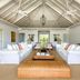 The Ungasan Clifftop Resort in South Kuta living room with white sofas and vaulted ceiling