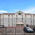 Woodspring Suites San Antonio South exterior with parking lot in San Antonio