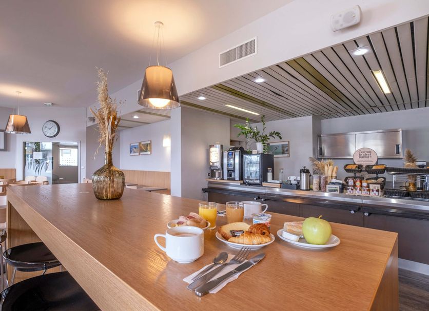 B&B HOTEL La Rochelle Centre breakfast bar with pastries and coffee in La Rochelle