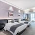 Beijing Lian Jie Hotel in Beijing guest room with two twin beds and large window view