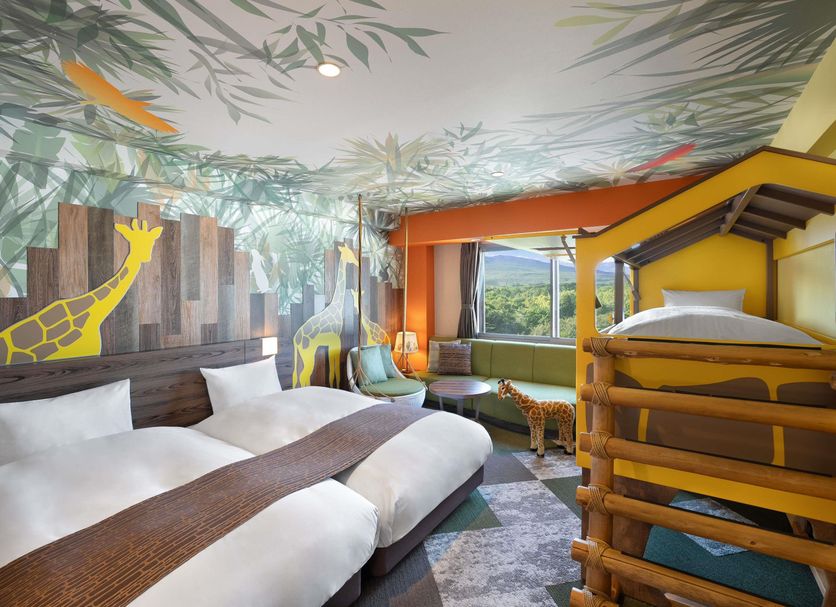 Grand Mercure Nasu Highlands Resort & Spa family room with bunk bed, giraffe mural, and mountain view in Nasu