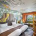 Grand Mercure Nasu Highlands Resort & Spa family room with bunk bed, giraffe mural, and mountain view in Nasu