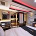 Daegu Innovalley hotel room in Daegu with large TV, desk and seating area, modern lighting