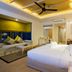 Mandarava Resort And Spa, Karon Beach room with king bed, hanging pendant light, and seating area